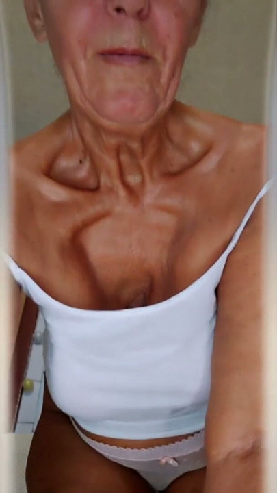 Cheerful housewife Lukerya in the kitchen | Clip 1