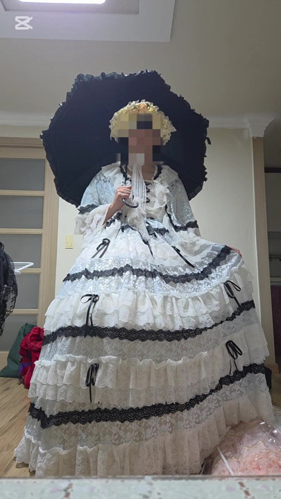 A man dressed as a woman wore a dress.