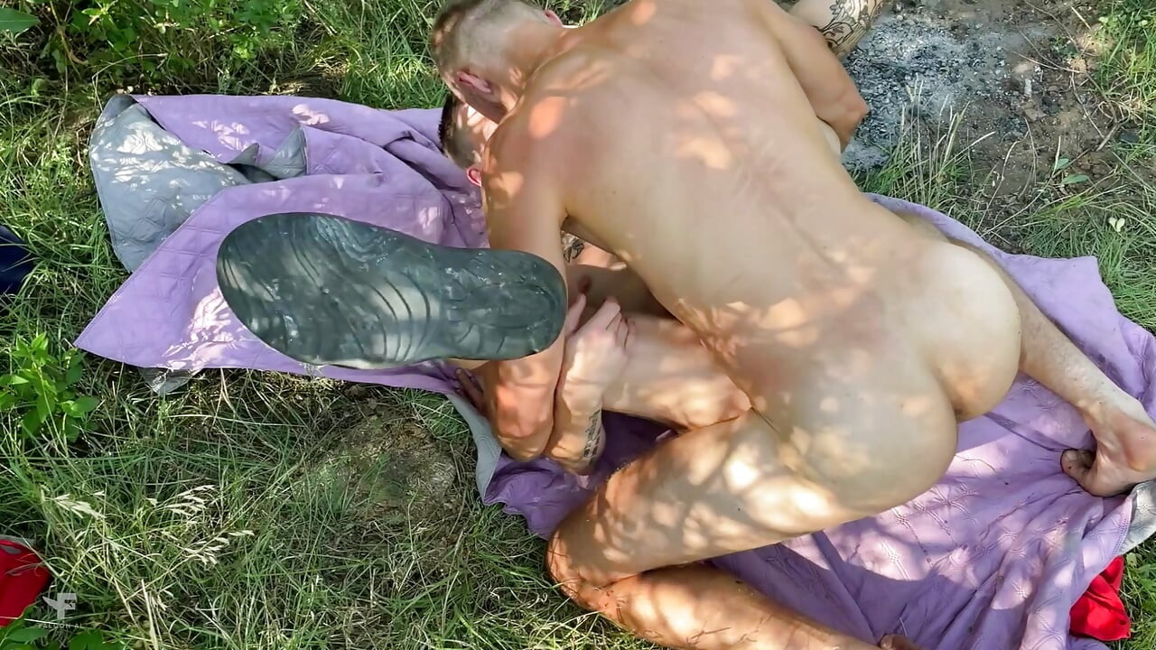 The guy moans softly with every thrust of the cock - guys fucking at a picnic