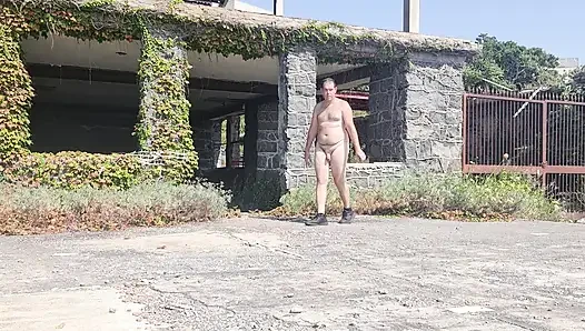 Boy completely naked near the sea