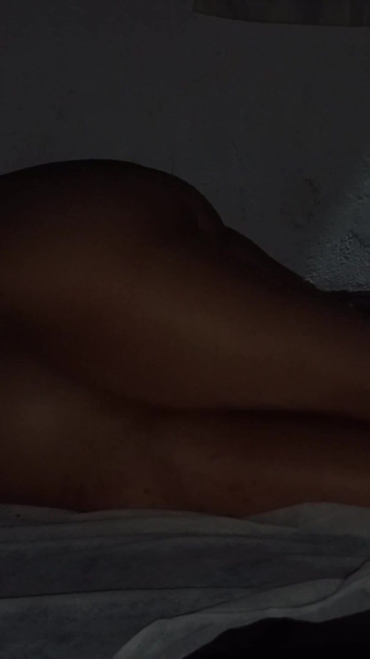 Romantic couple's massage with candles and gliding movements. | Clip 1