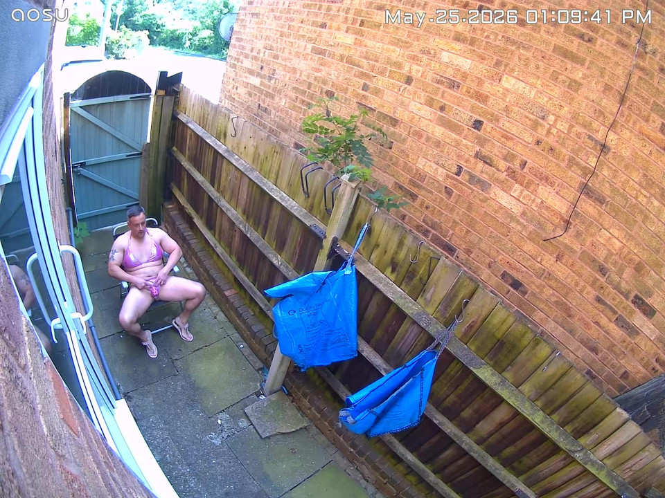 Caught on my neighbours camera in my pink bikini, caged clit and butt plug in.