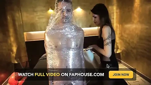 Femdom girl puts her slave in tape bondage