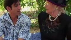 Granny fucks and squirts outdoor
