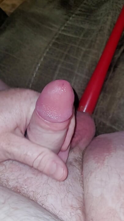 Watch my hard little cock cum with my ass filled up