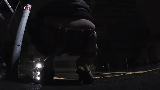 Mature sissy CD out in the rain in A parking lot in public masturbation.