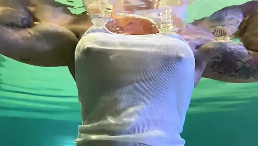 Amazon Kandy Flexes Her Massive Biceps in Her Hotel Pool