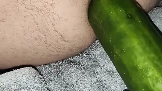 My wife is fucking my ass with a huge cucumber.