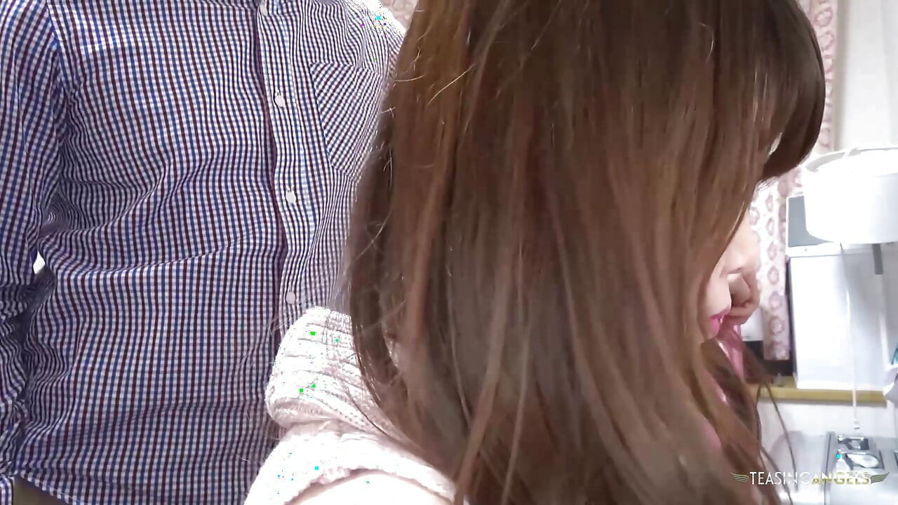Using a sex toy to stimulate an Asian woman's genitals in order to bring her to orgasm