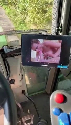Farmer drives tractor