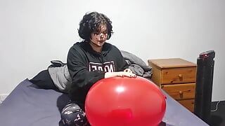 Clown girl Blowing up and popping huge balloon
