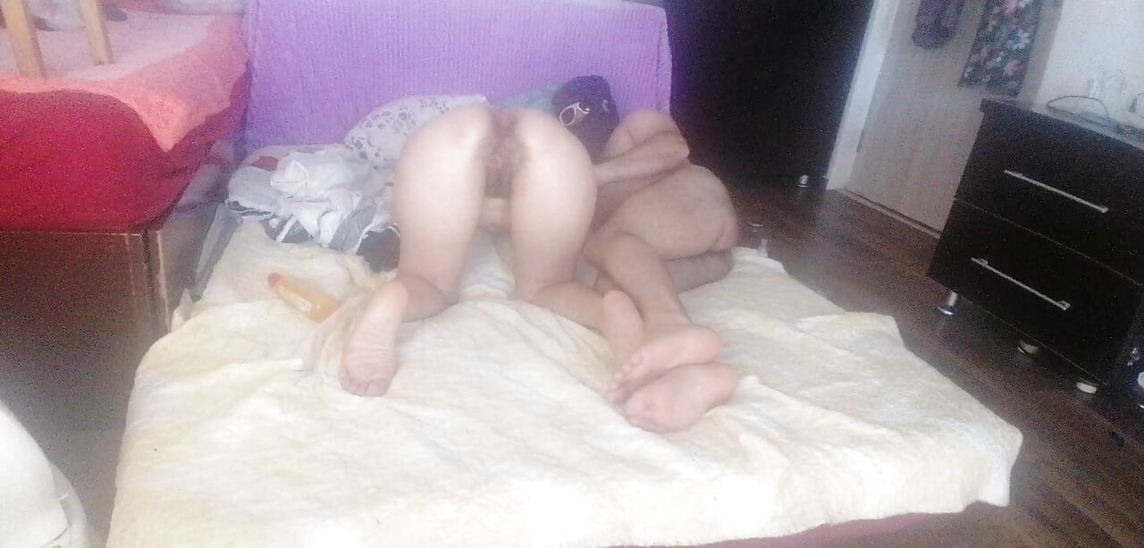 Sensual massage of a hot couple with oil on the body.