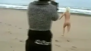 Daring Blond Bares All on a Cold Beach
