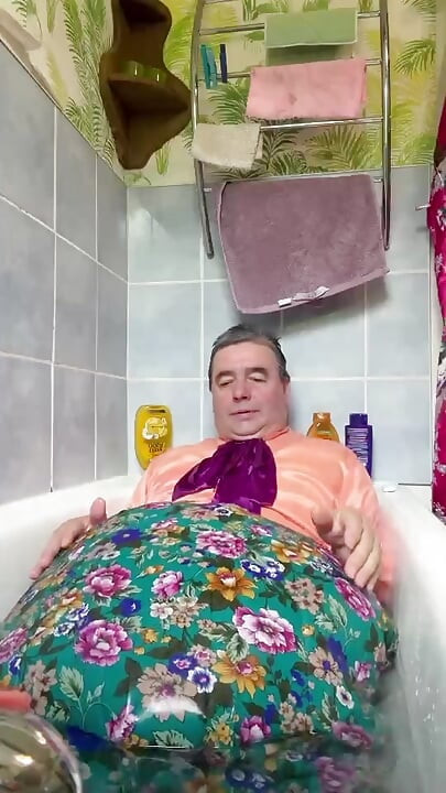 In vintage maid outfit to take a bath fully dressed