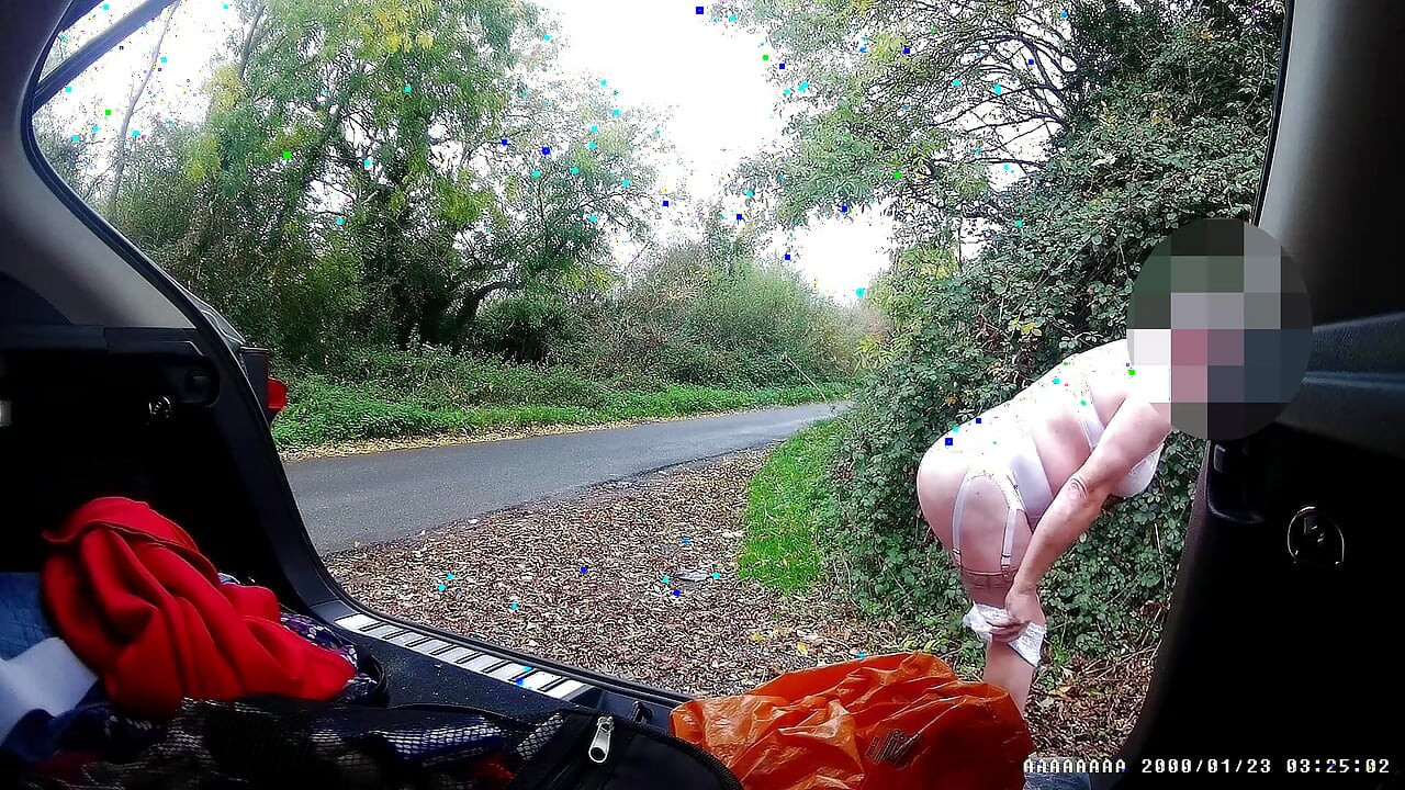 Just getting changed parked at side of road with cars driving past
