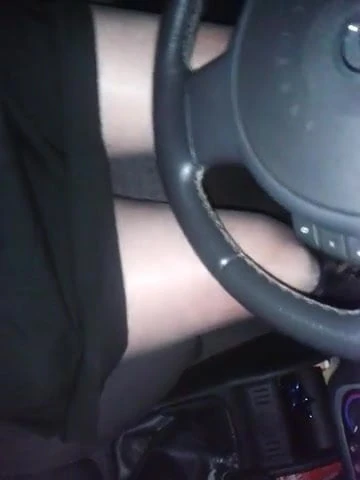 Driving with black shiny pantyhose and pleated skirt