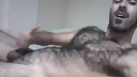 hairy Arab stud jacks out a load and tastes his cum