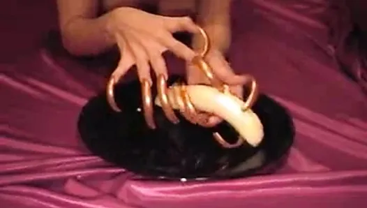 nails clawing banana