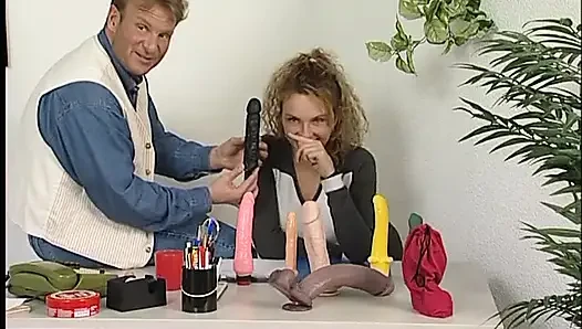 Blonde teen gets pussy fingered in the room full of dildos