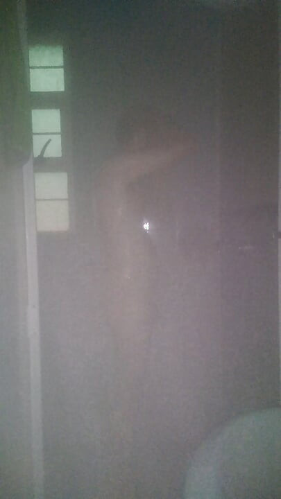 Man Showering with Flashlight On