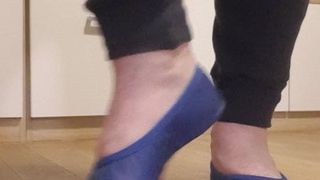 Blue leather gymnastic slipper play with a dildo