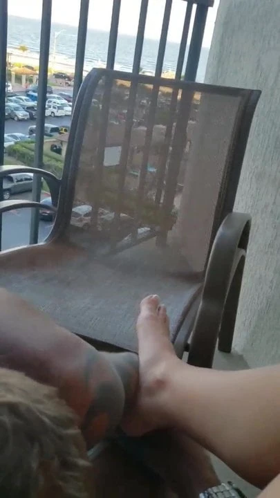Wife on balcony