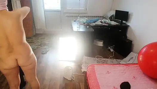 Amateur woman has fun trying on clothes and cutting them.