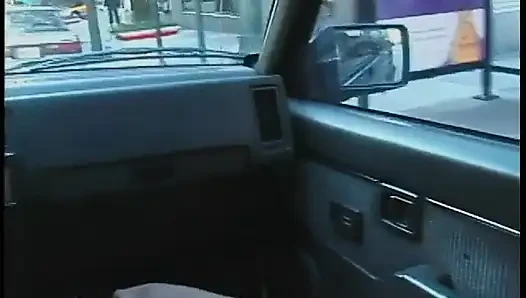Commuter redhead carpools with creep who debases her in car in city traffic