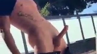 exposing a big cock in the pool
