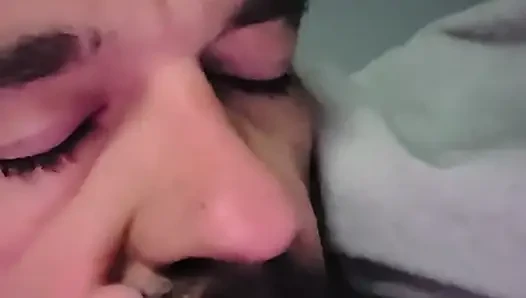 Sucking her toes while she watches a movie
