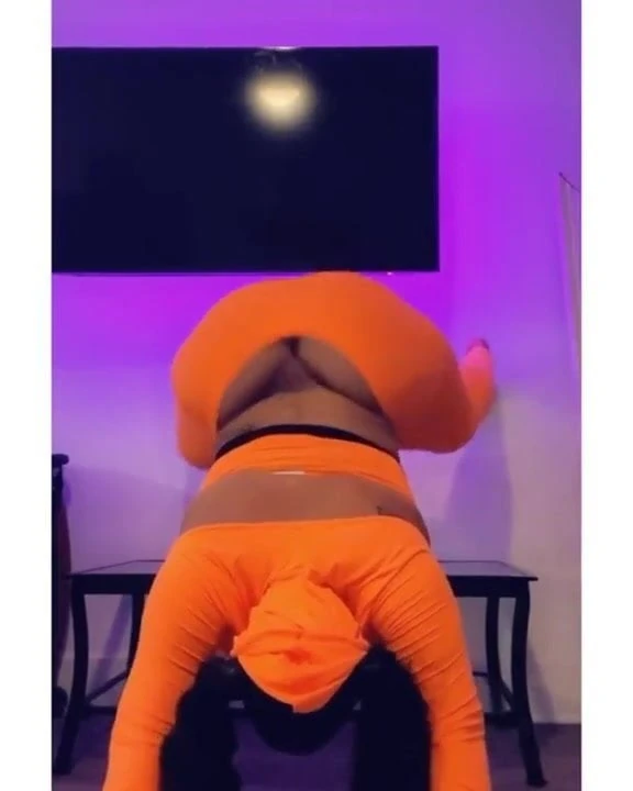 Ghetto Barbie twerking in orange jumpsuit and hoodie