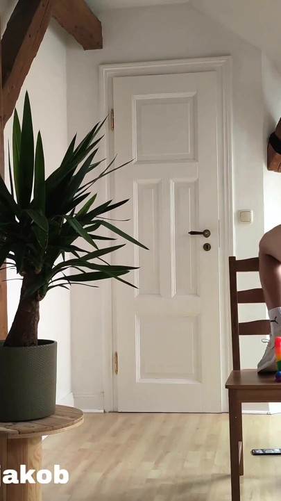 A boy rides a rainbow dildo