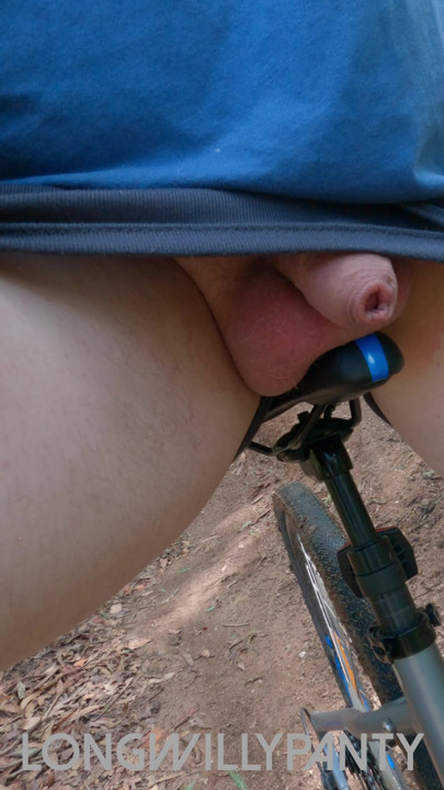 Amateur straight guy riding bike with his cock on show in public flashing.