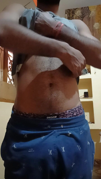 Black haired gay showing nude body solo