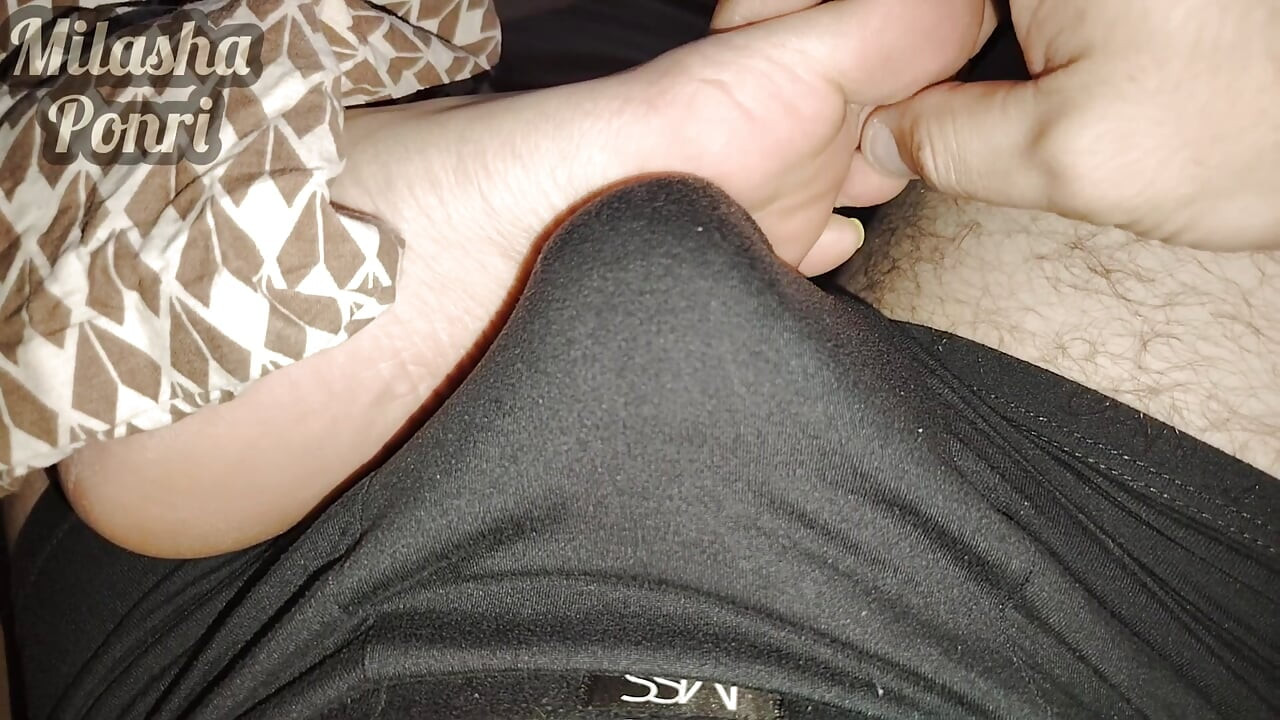 Stepsister's feet get a light massage while watching a movie