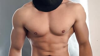 Young bodybuilder posing in a tight jock