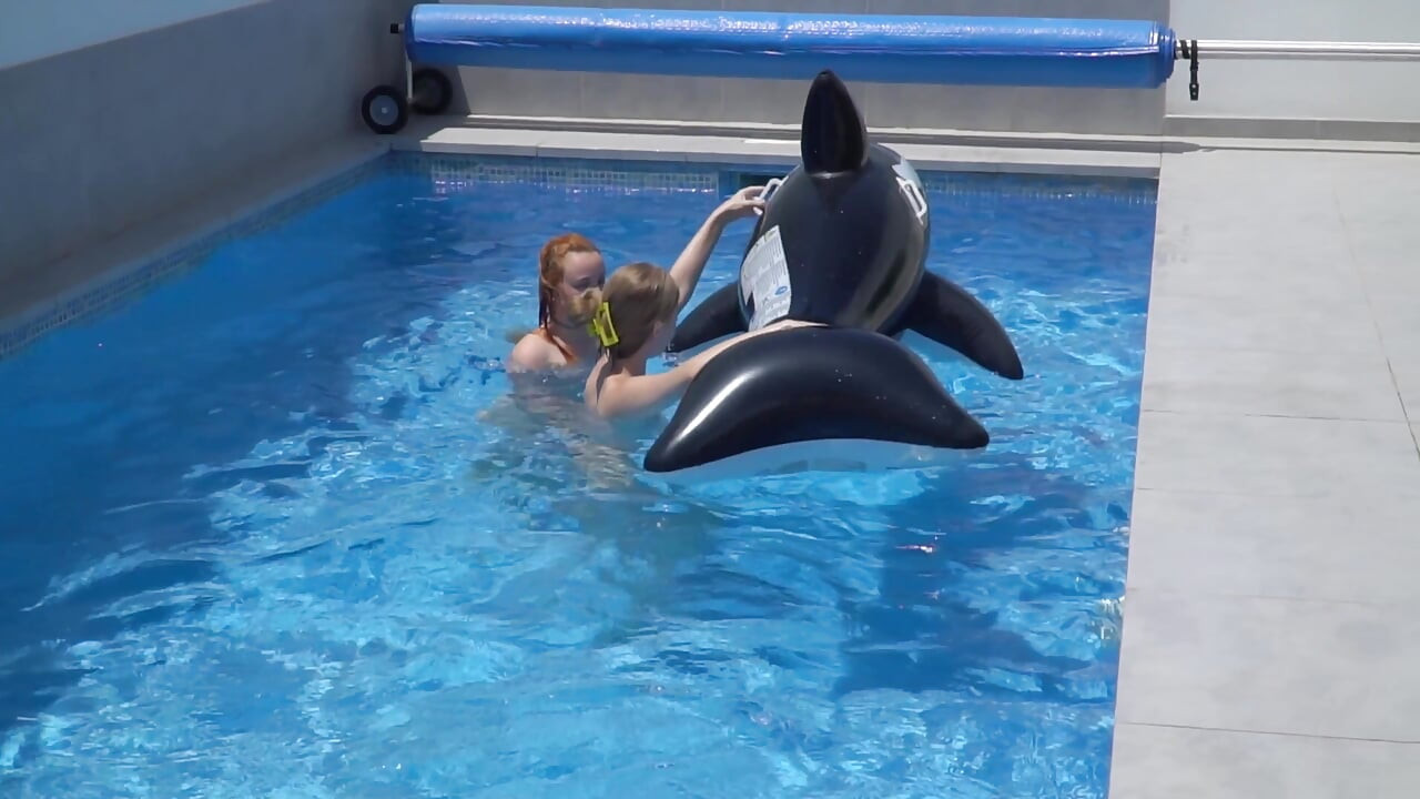 Lesbian Girls Are Having Fun in a Pool with an Inflatable Shark