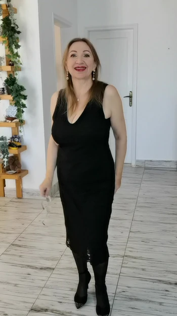 Hot granny teasing by black stockings and beautifull legs