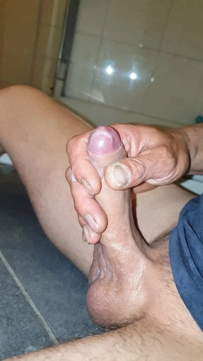 Young guy jerks big uncut cock to huge cumshot