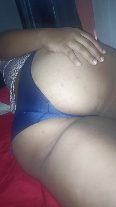 Chubby wife shows her buttocks on the bed