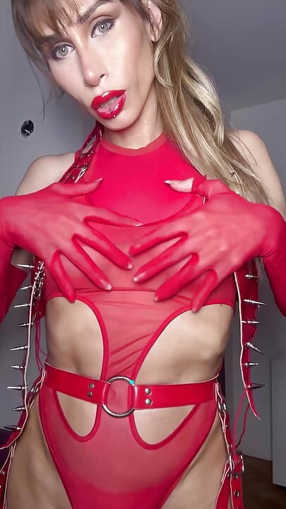 Blonde Trans in Red Latex BDSM Costume Dances