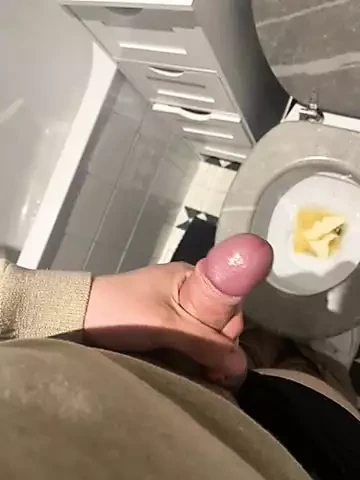 An 18-year-old masturbates in his toilet while he prepares food.