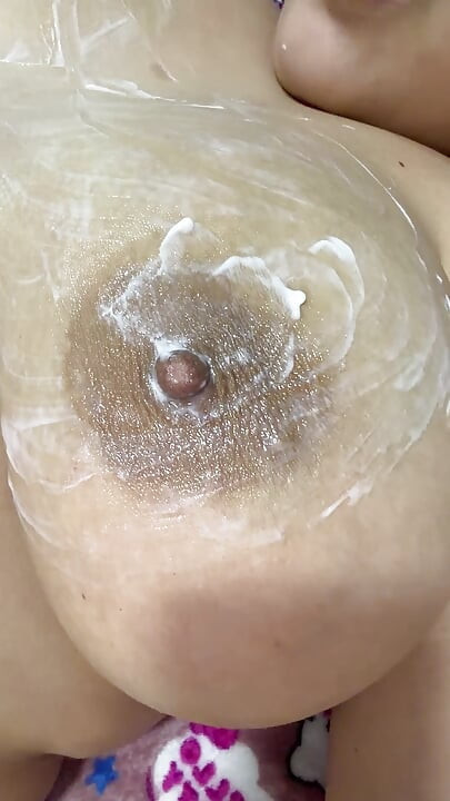 Mom vibrates her big tits with her big vibrator