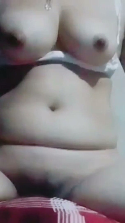 Hot desi bhabhi is masturbating while pressing her boobs and caressing her nipples, she is getting orgasm while caressing her | Clip 1