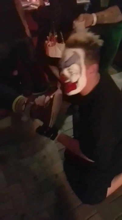 Clown Having Some Feet On His Face