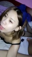 sweet asian girl taking selfie while sucking a cock