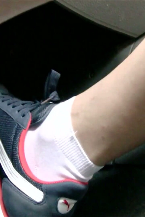 Driving in Blue Nike Sneakers and White Socks