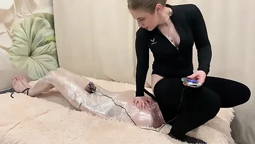 The Head Is in the Pants of the Mistress, the Slave Receives Electric Shocks and Tries to Breathe