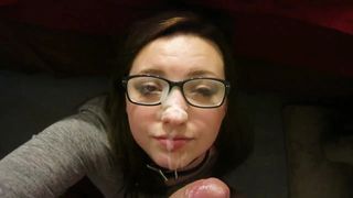 Geek girl in glasses taking facial