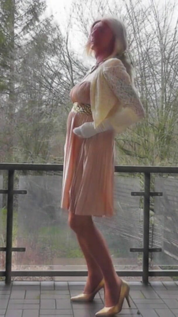 Memorable moment from "Wanking On A Winday Day In My Shiny Pleated Satin Gown"